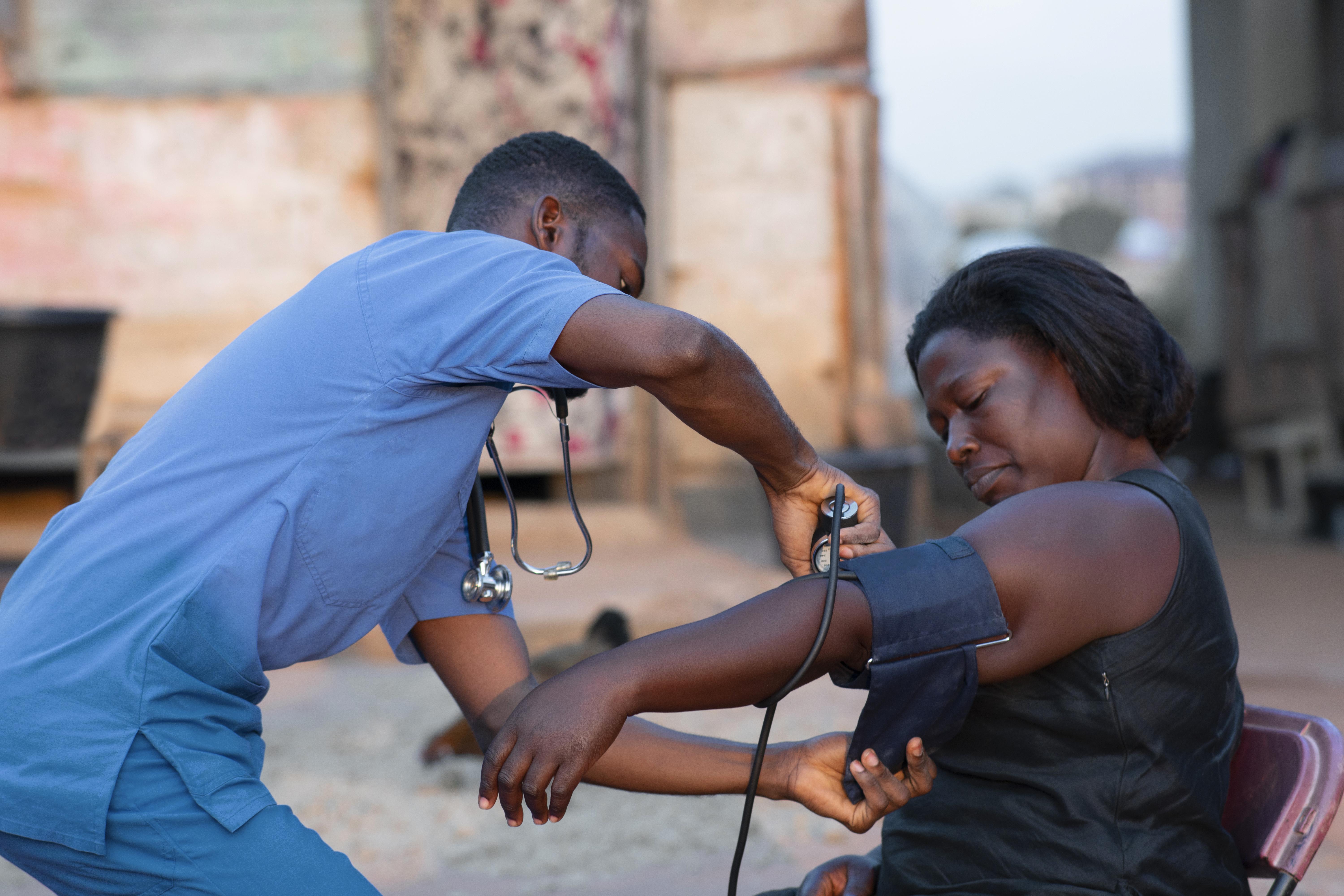 Health worker attending to a community member