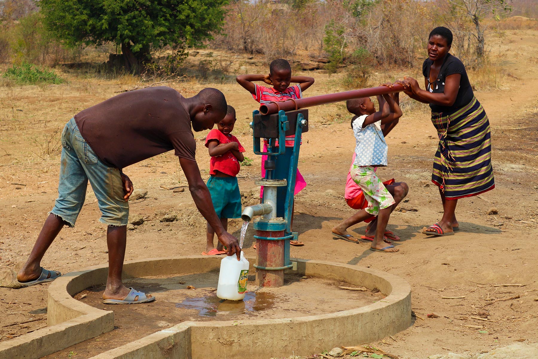 A family using a new water pump